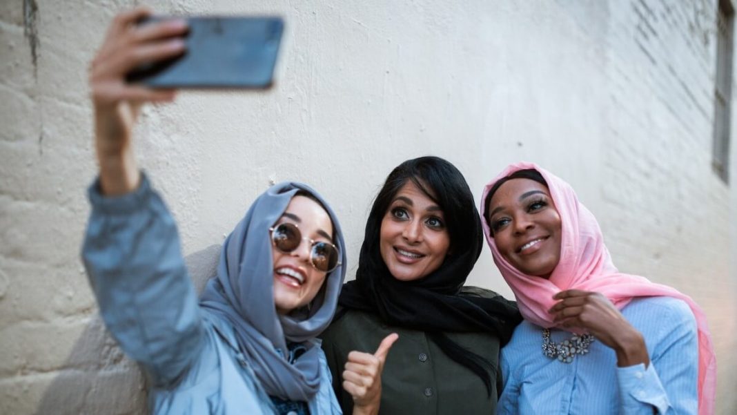 hijabi group of women taking selfie together