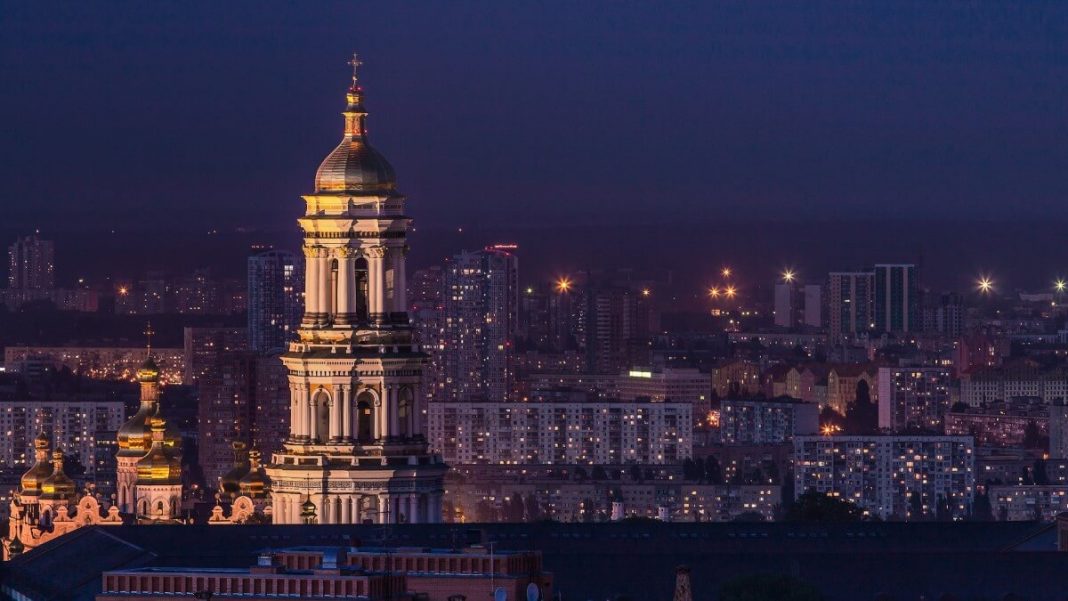 white building kyev ukraine nighttime citylights