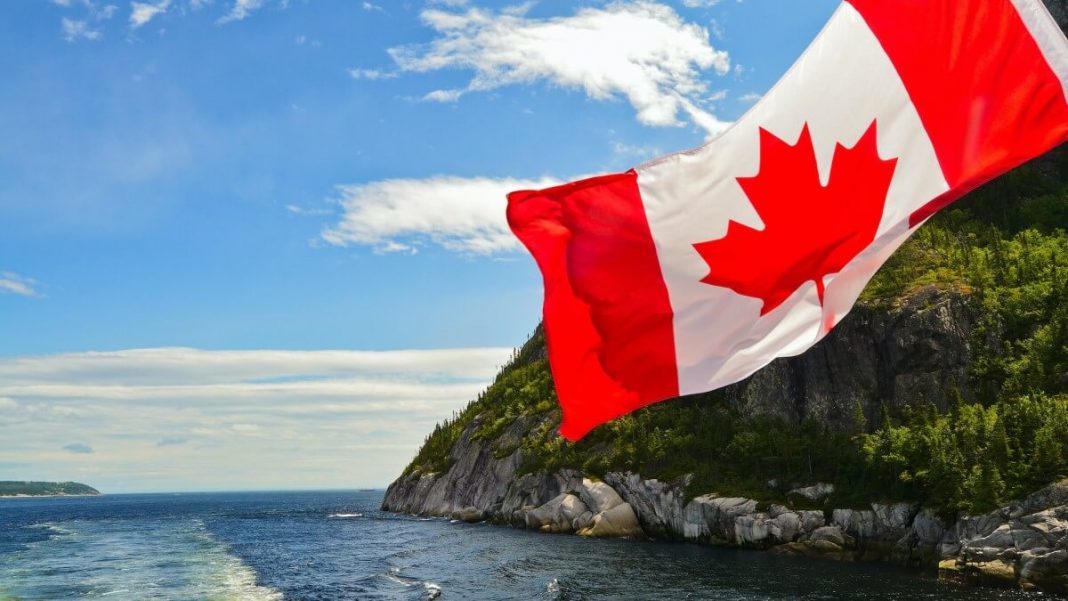 canada flag waving river hill view