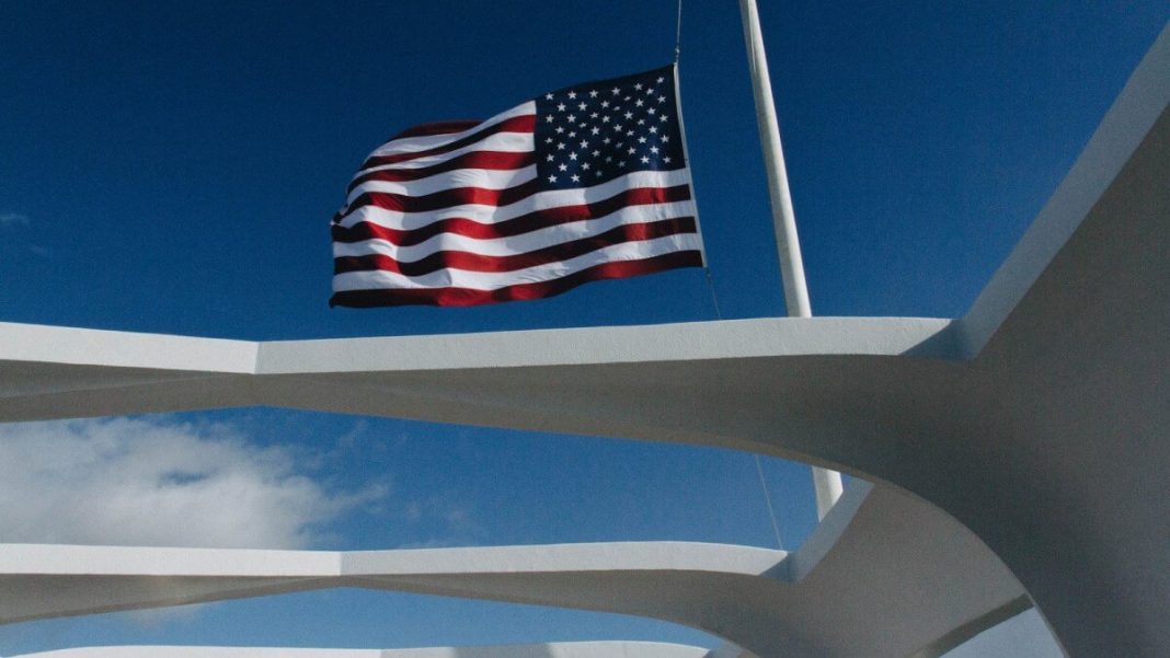 american flag waving during daytime
