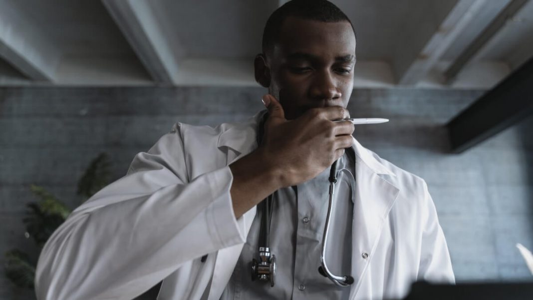 doctor checking his notes