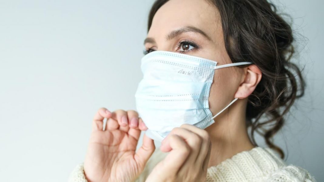 woman wearing blue mask
