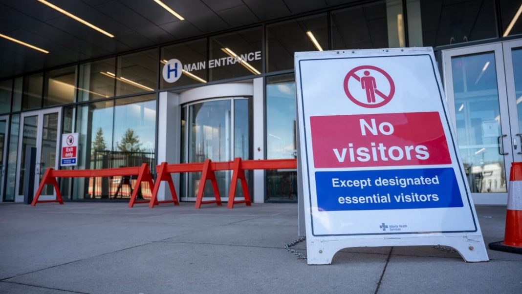 no visitors red blue banner before building entrance