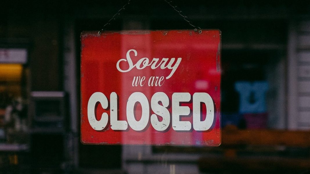 sorry we are closed red and white sign