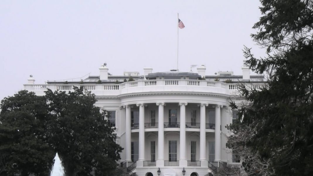 us flag on top of white house building washington dc