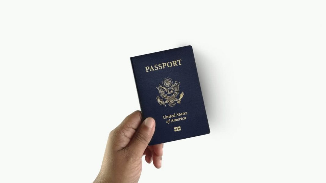person holding passport white background