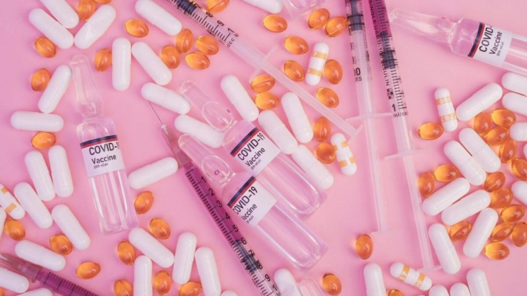 covid19 vaccine bottles and syringes