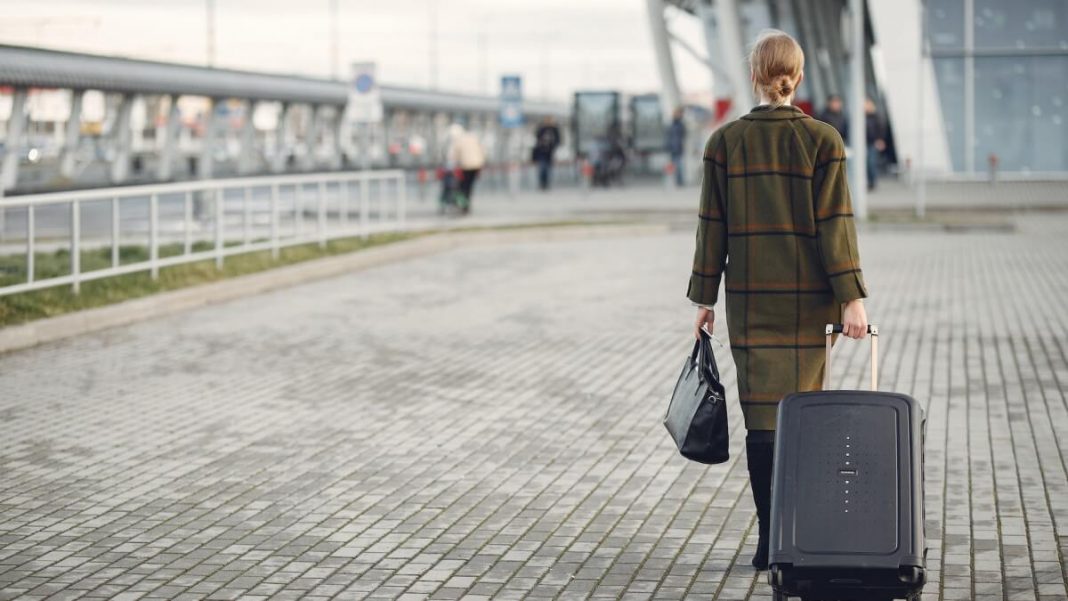 woman with luggage and bag