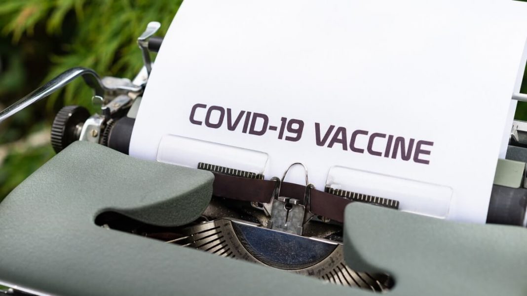 covid-19 vaccine typewriter