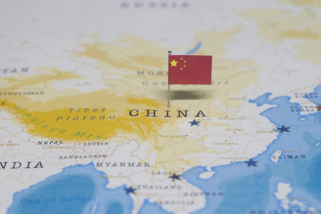 china flag pinned on map