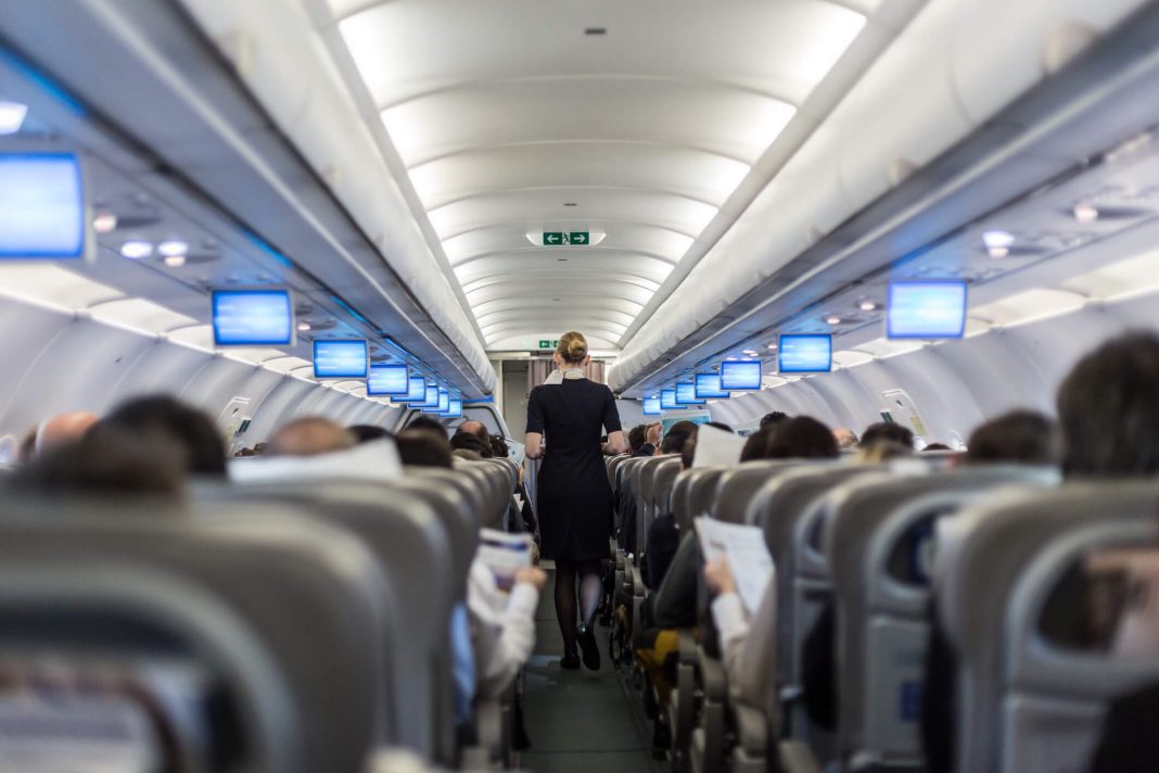 Passengers in airplane cabin interior
