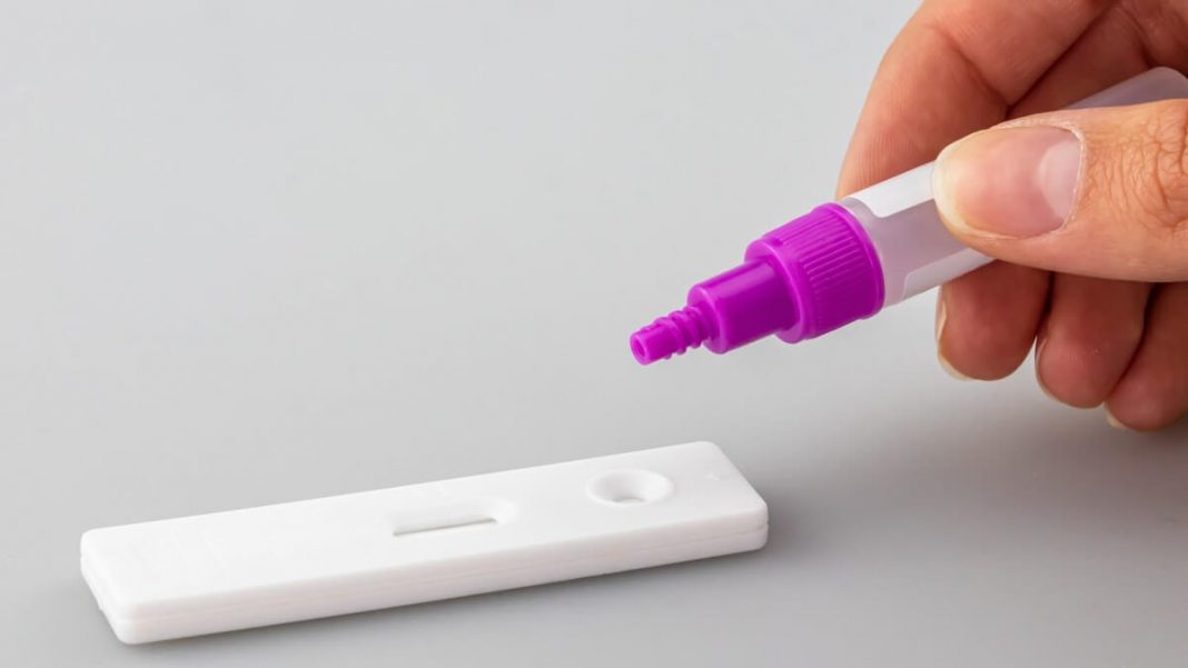 covid test purple plastic bottle