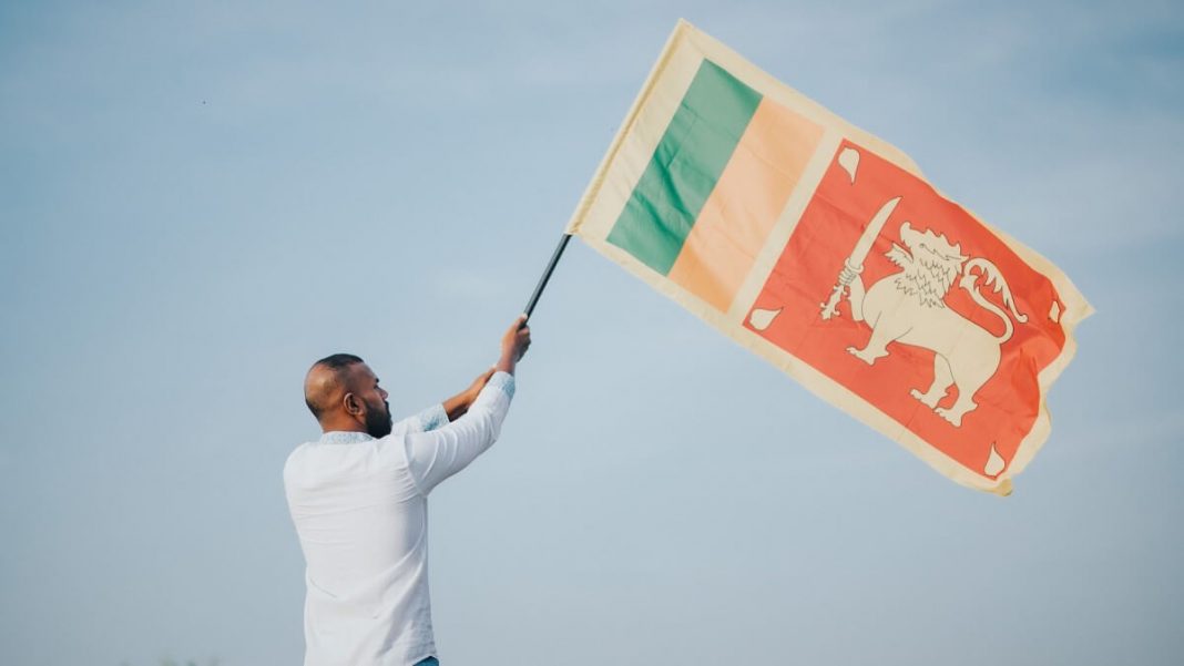 man waving sri lanka flag