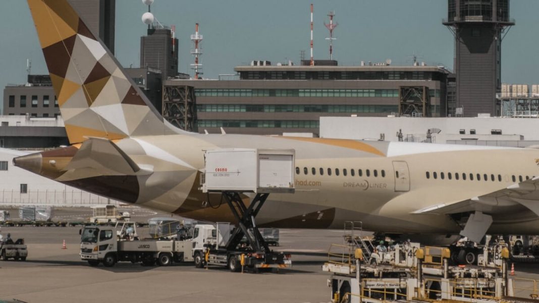 grey gold airplane narita airport railway japan