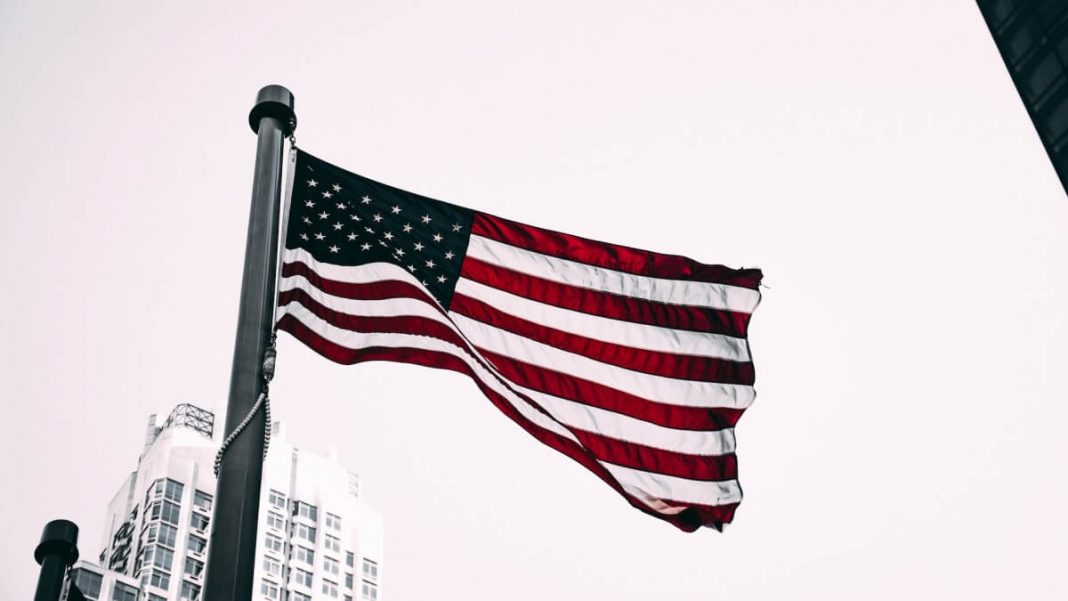 us flag in front of white building