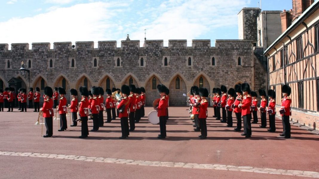uk troops wearing red and black clothing