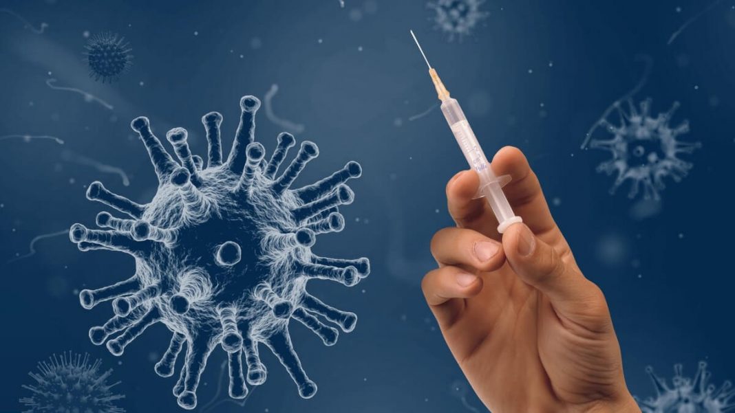 person holding covid-19 vaccination syringe