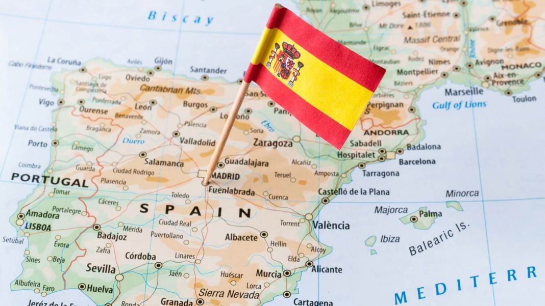 spanish flag pinned on the map
