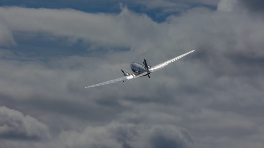 airplane flying high clouds view