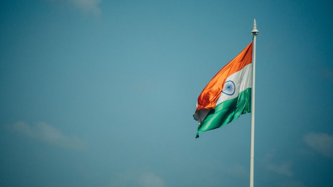 india flag waving in the wind blue sky background