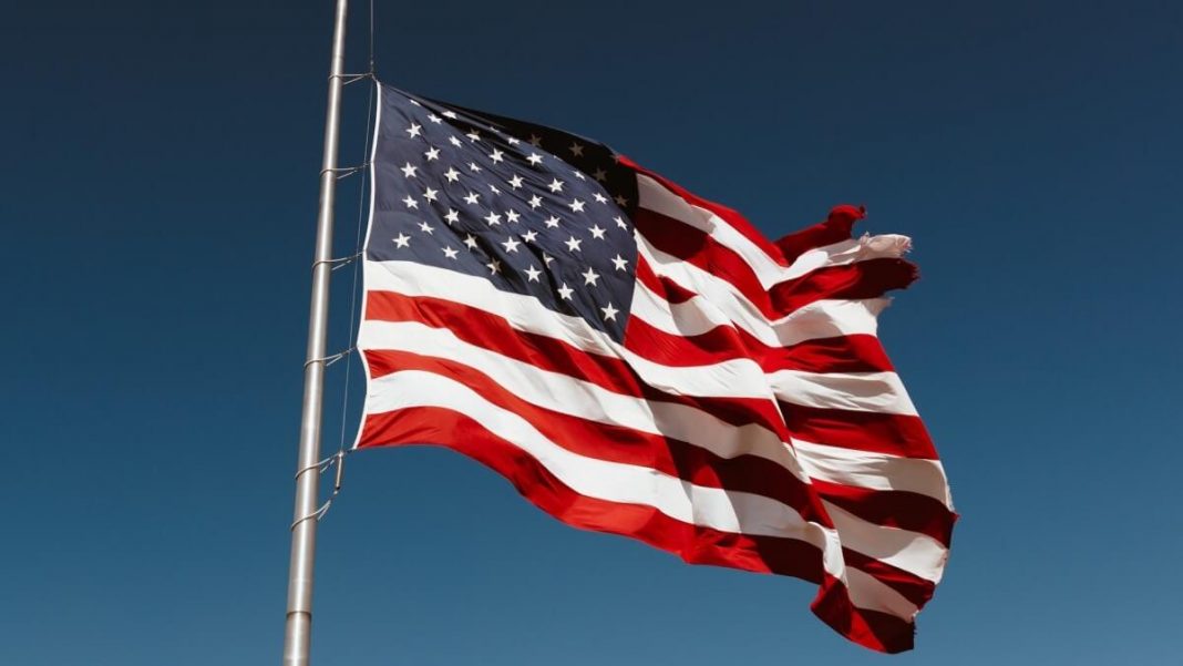 usa flag waving blue sky background