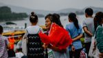 chinese man selling china flags