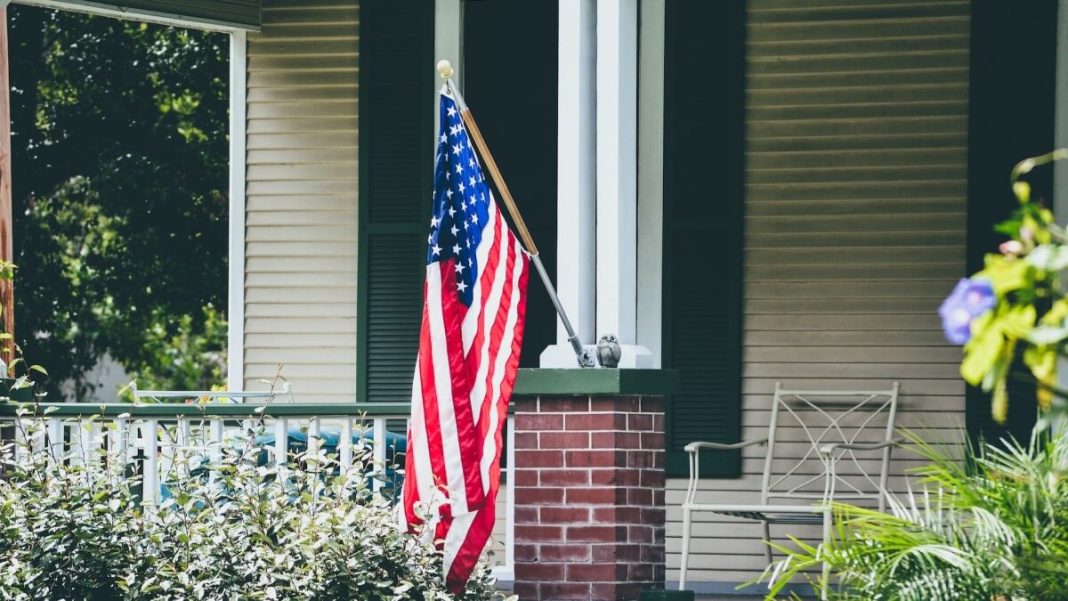 us flag hanging on a balcony