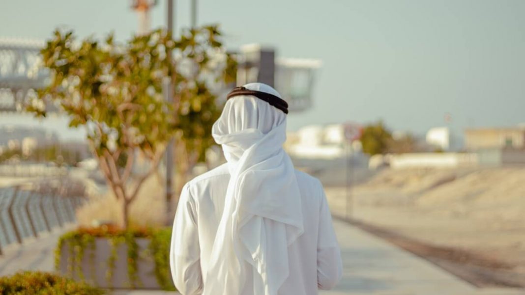 man in white uae traditional robe