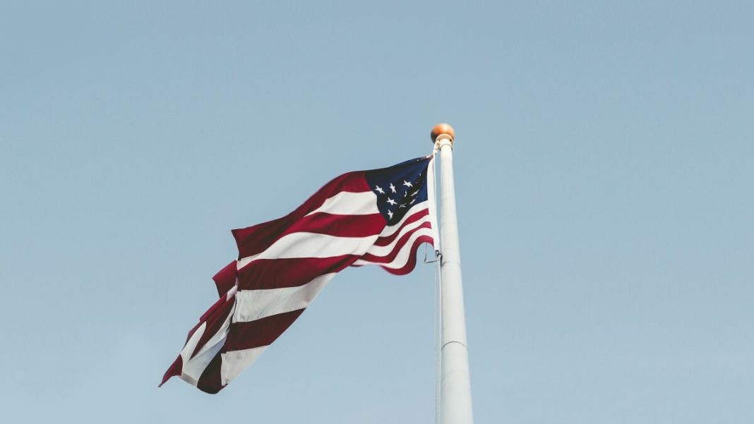 us flag on white flagstaff