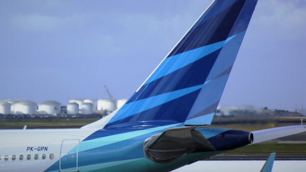 blue white airplane indonesia garuda airlines