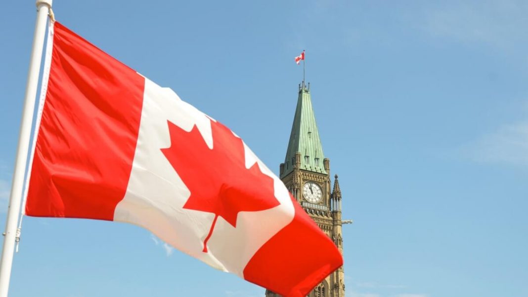 canada flag waving ottawa parliament building view