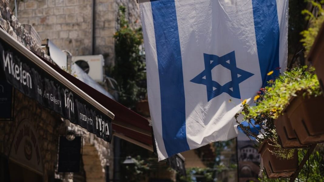 israel flag hanging city view