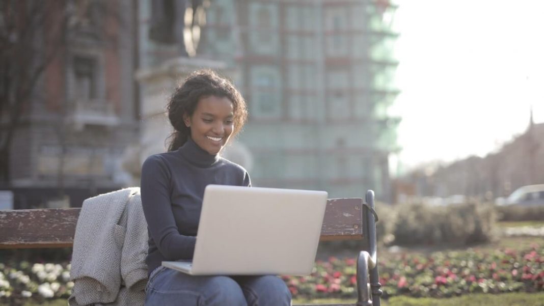 girl holding laptop