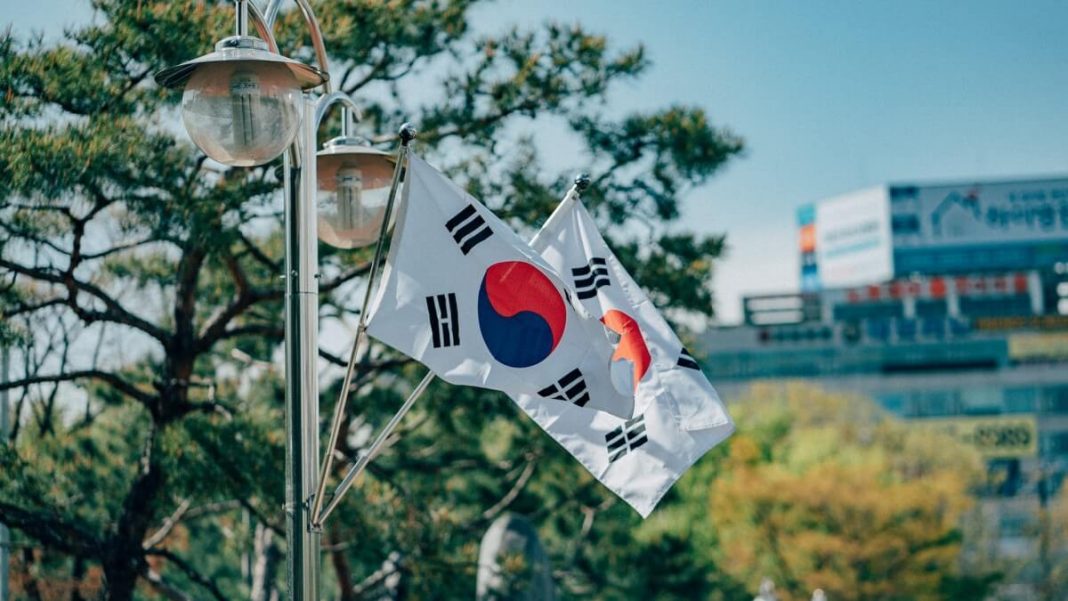 south korea flags waving trees and buildings background
