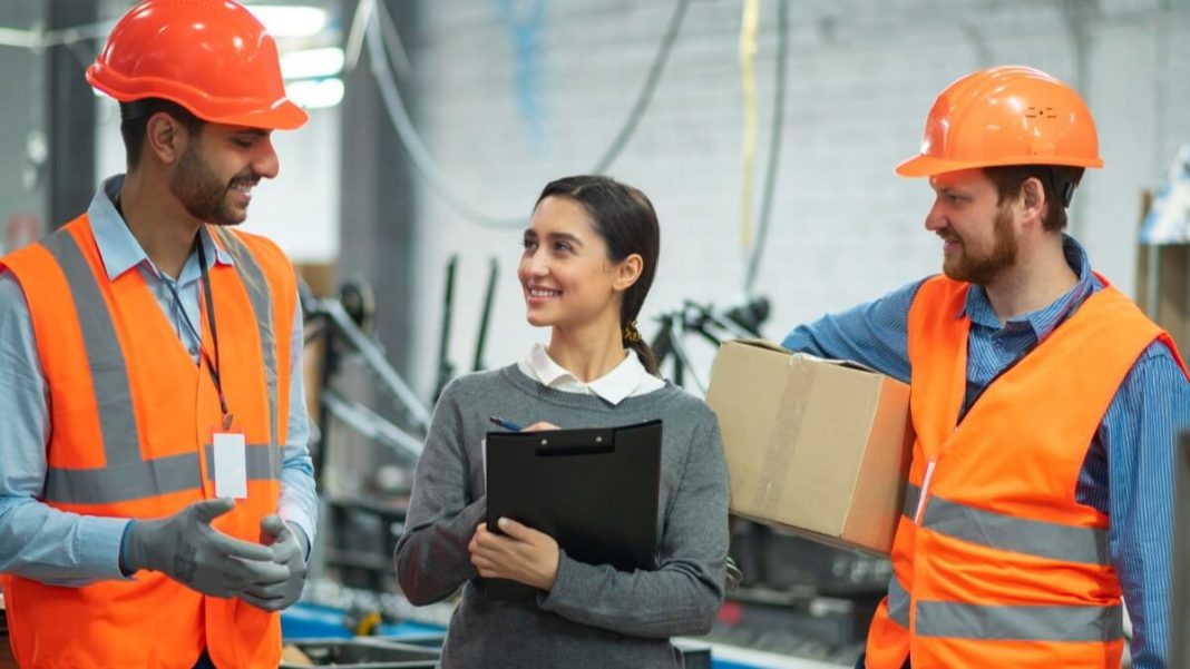 People in safety equipment at their workplace
